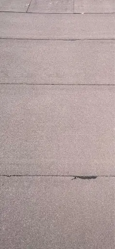 Weathered flat roof membrane Vaughan 416-616-6761 before restoration