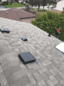 Asphalt roof with ventilation boxes
