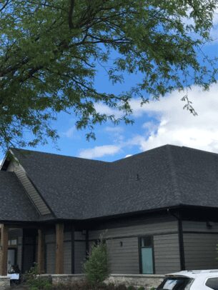 A house with a black shingle roof